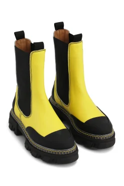 Shop GANNI Cleated Mid Chelsea Boot Transparent Welt Lemon Zest
